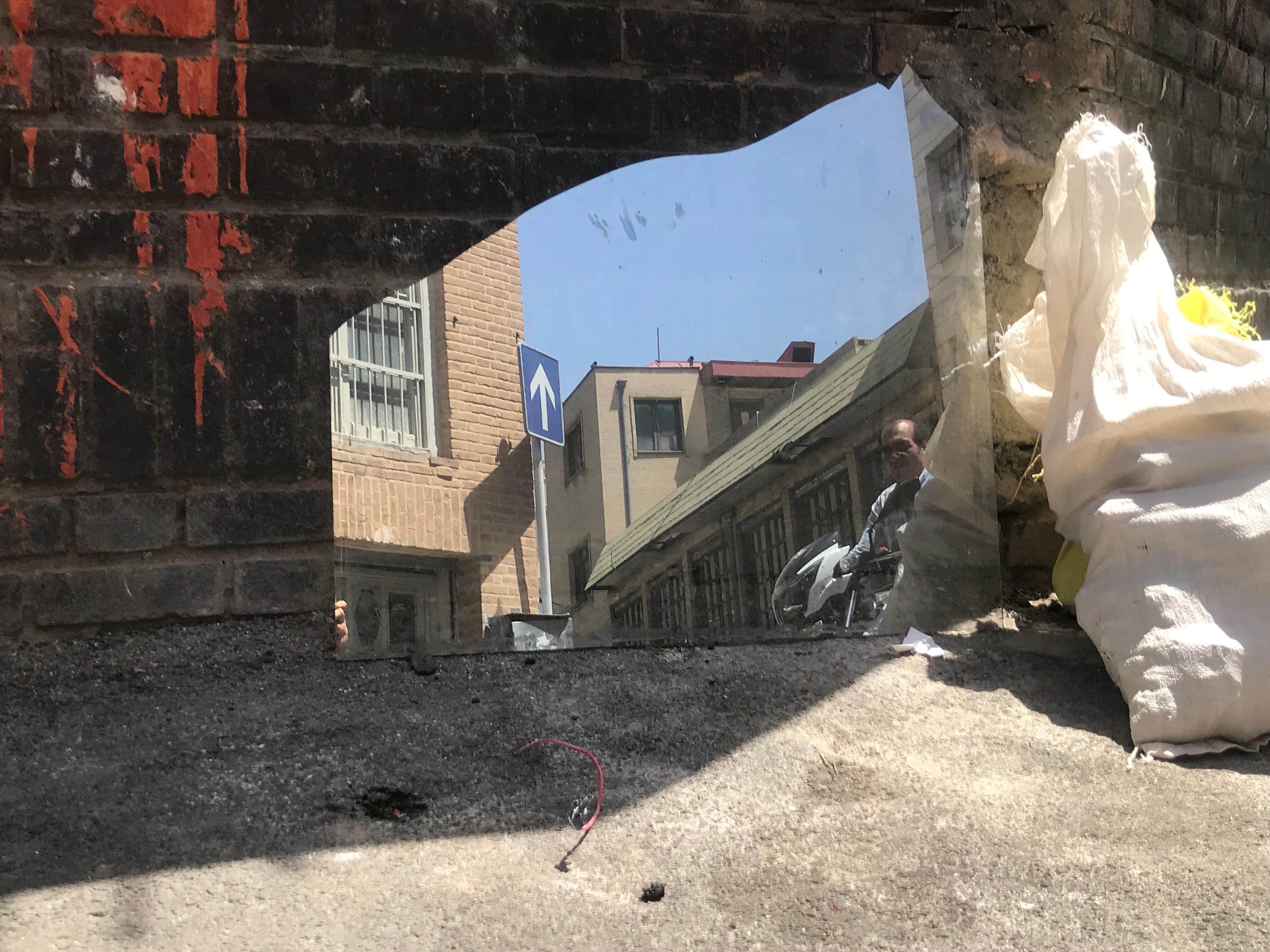 Man Sneaking in from a Broken Mirror